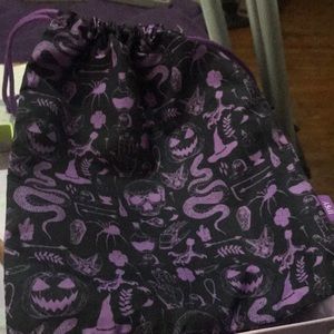 Ipsy bag draw string closure black and purple kind of Halloween like